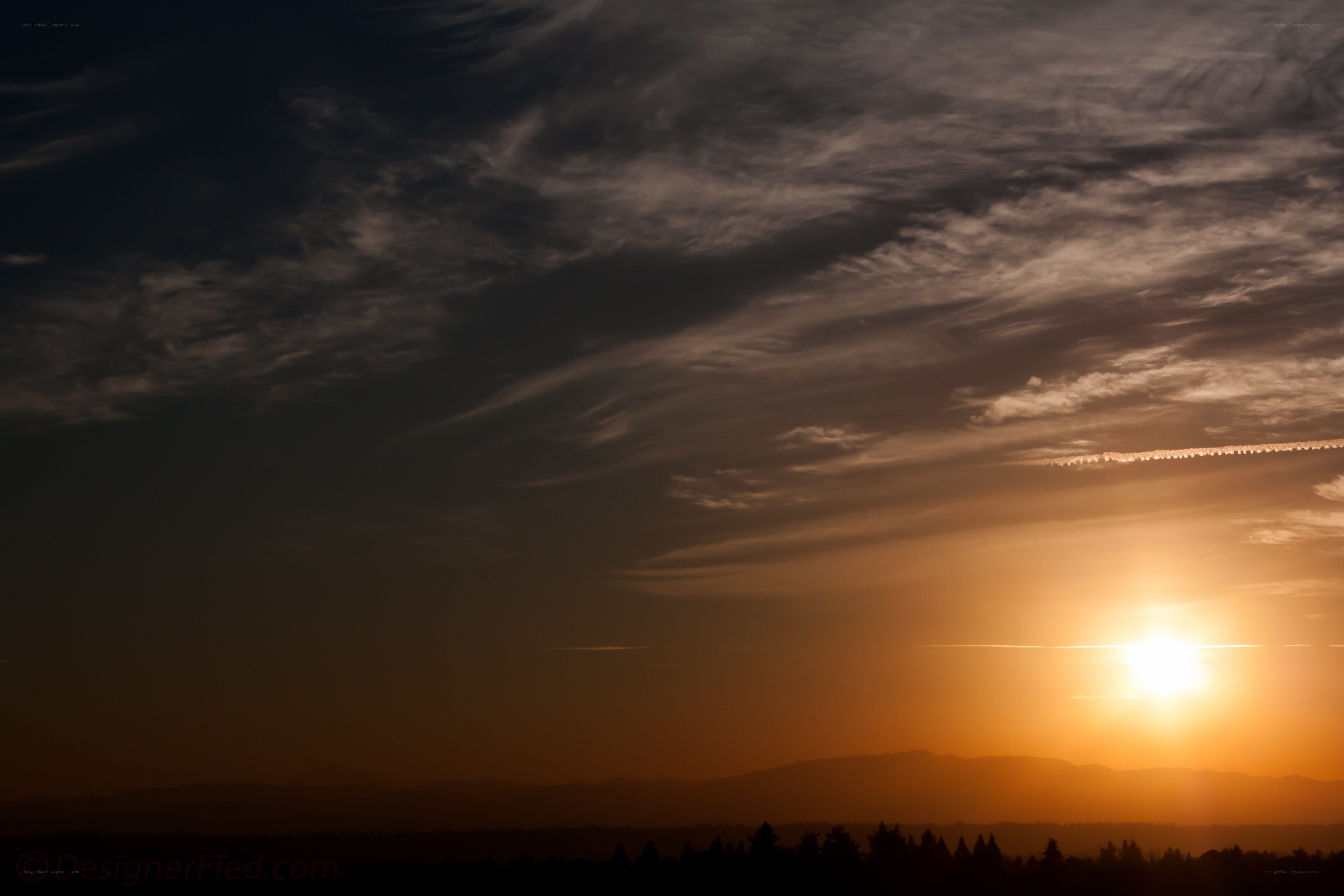 Sunset over distant mountains