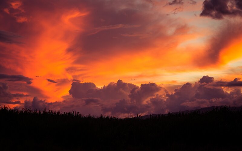 Sunset over Field — Orange, Dramatic, Photograph, Clouds, Mountains
