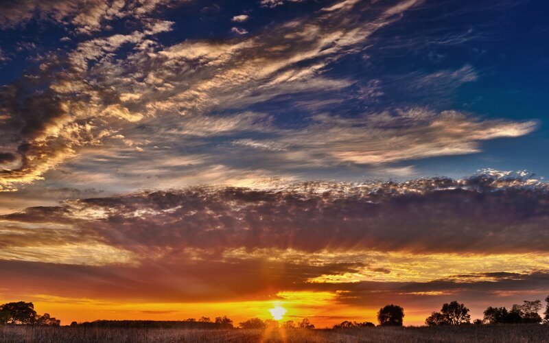 Sunset over Field — Orange, Dramatic, Photograph, Clouds, Trees, Sun