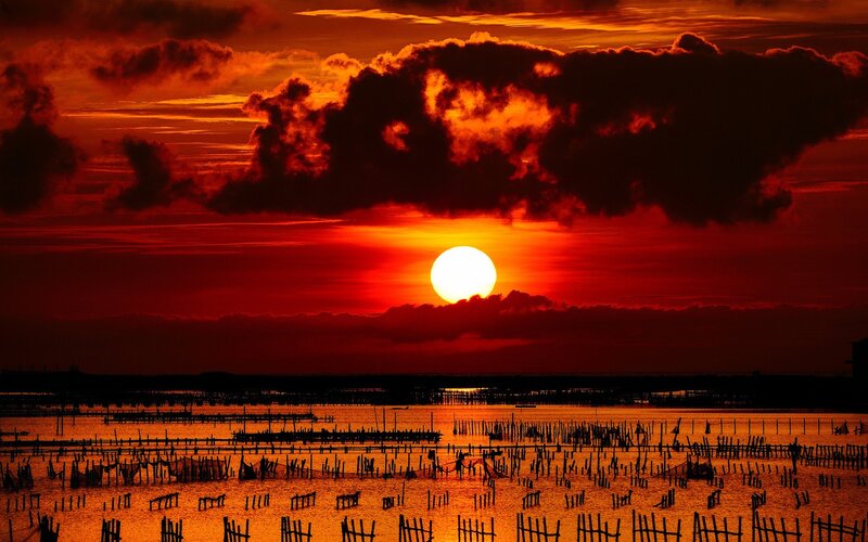 Sunset over Fishing Nets — Red, Dramatic