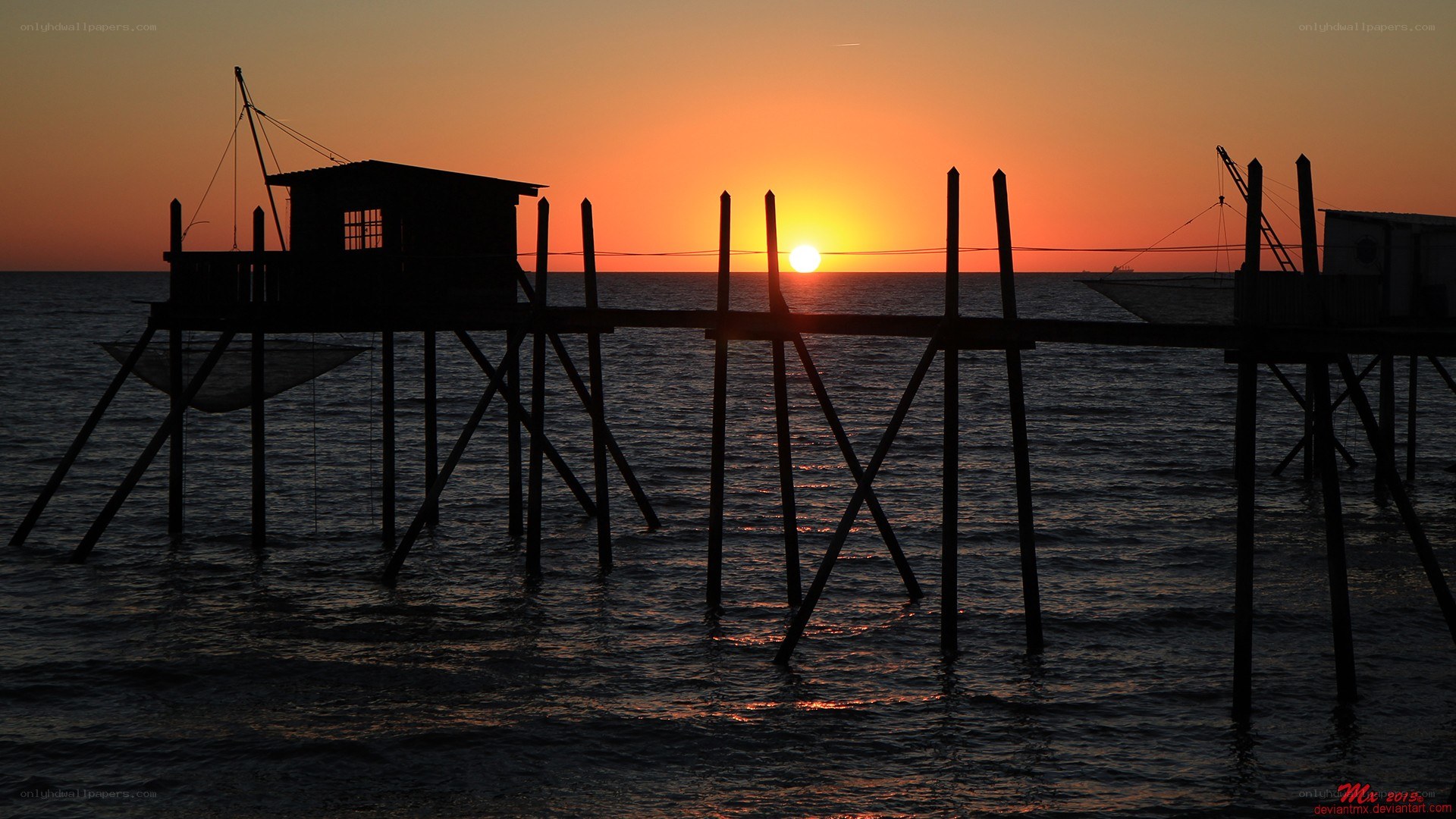 sunset over fishing pier