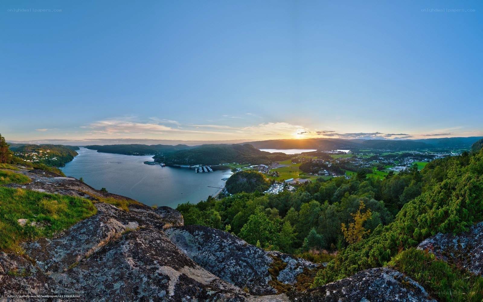 sunset over fjord landscape