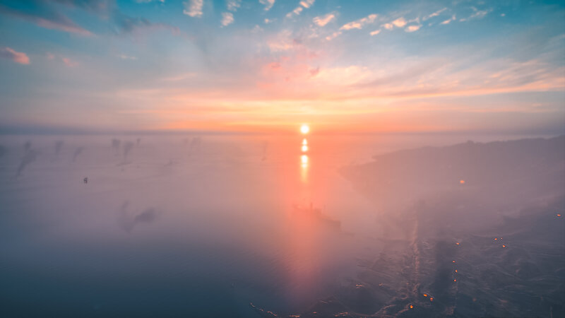 Sunset over Foggy Sea