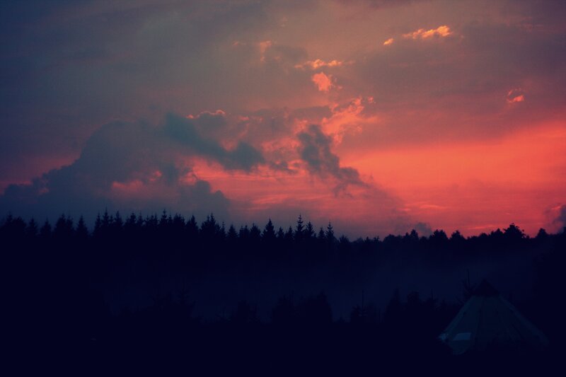sunset over forest camp