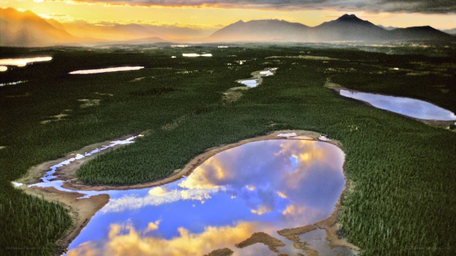 Sunset over forest lakes