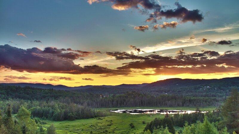 Sunset over Forested Hills — Blue, Dramatic, Photograph, Clouds