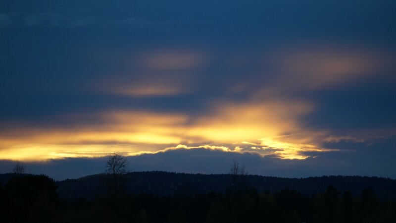 Sunset over Forested Hills — Blue, Dramatic, Photograph