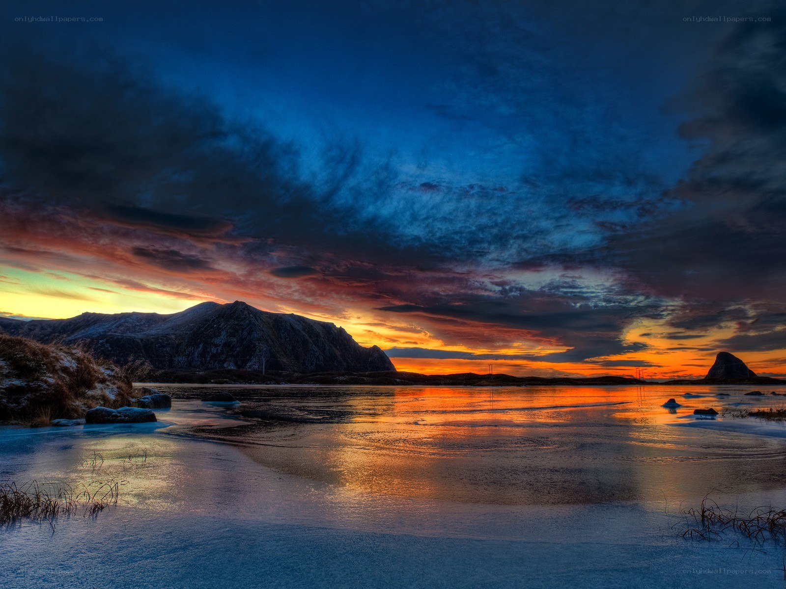 Sunset over frozen bay