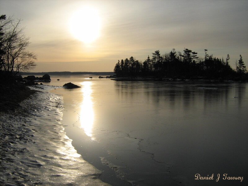 Sunset over frozen bay