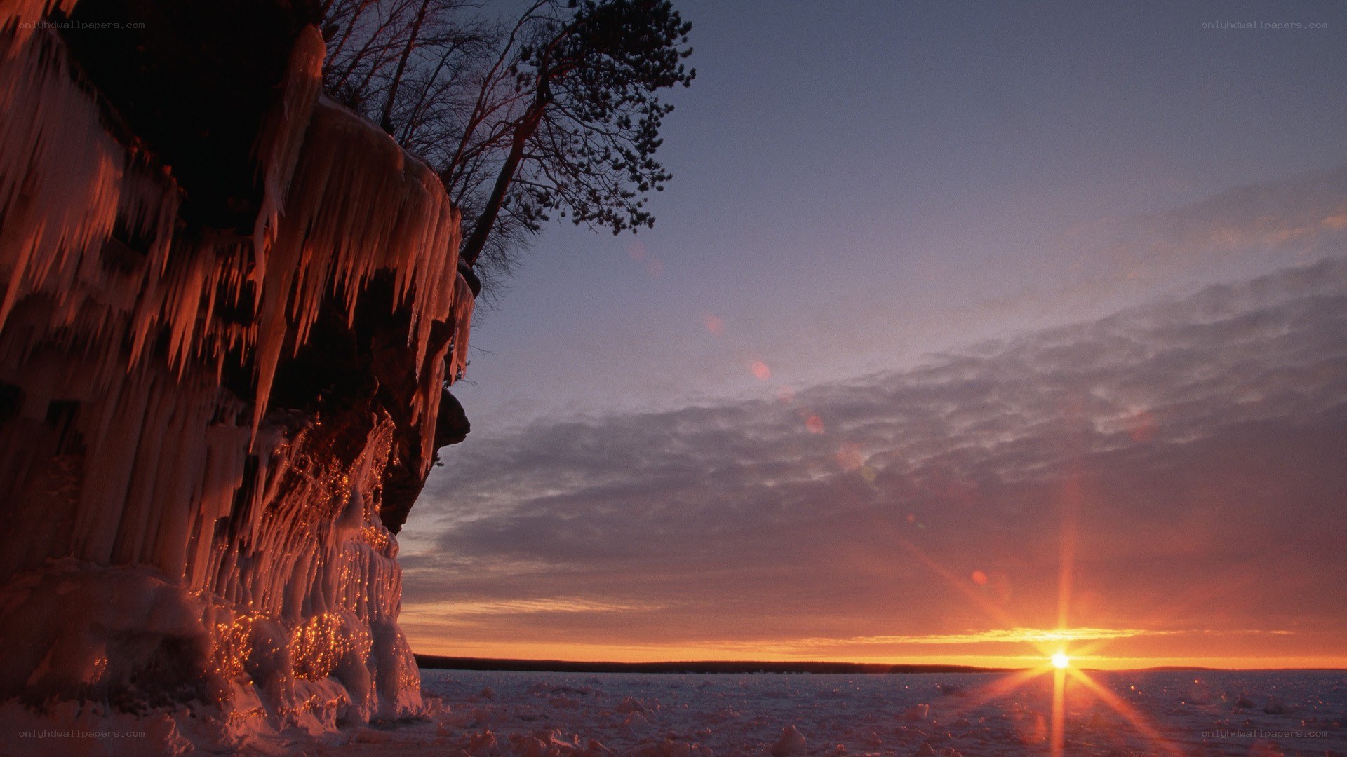 Sunset over frozen cliff