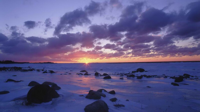 Sunset over frozen coastline