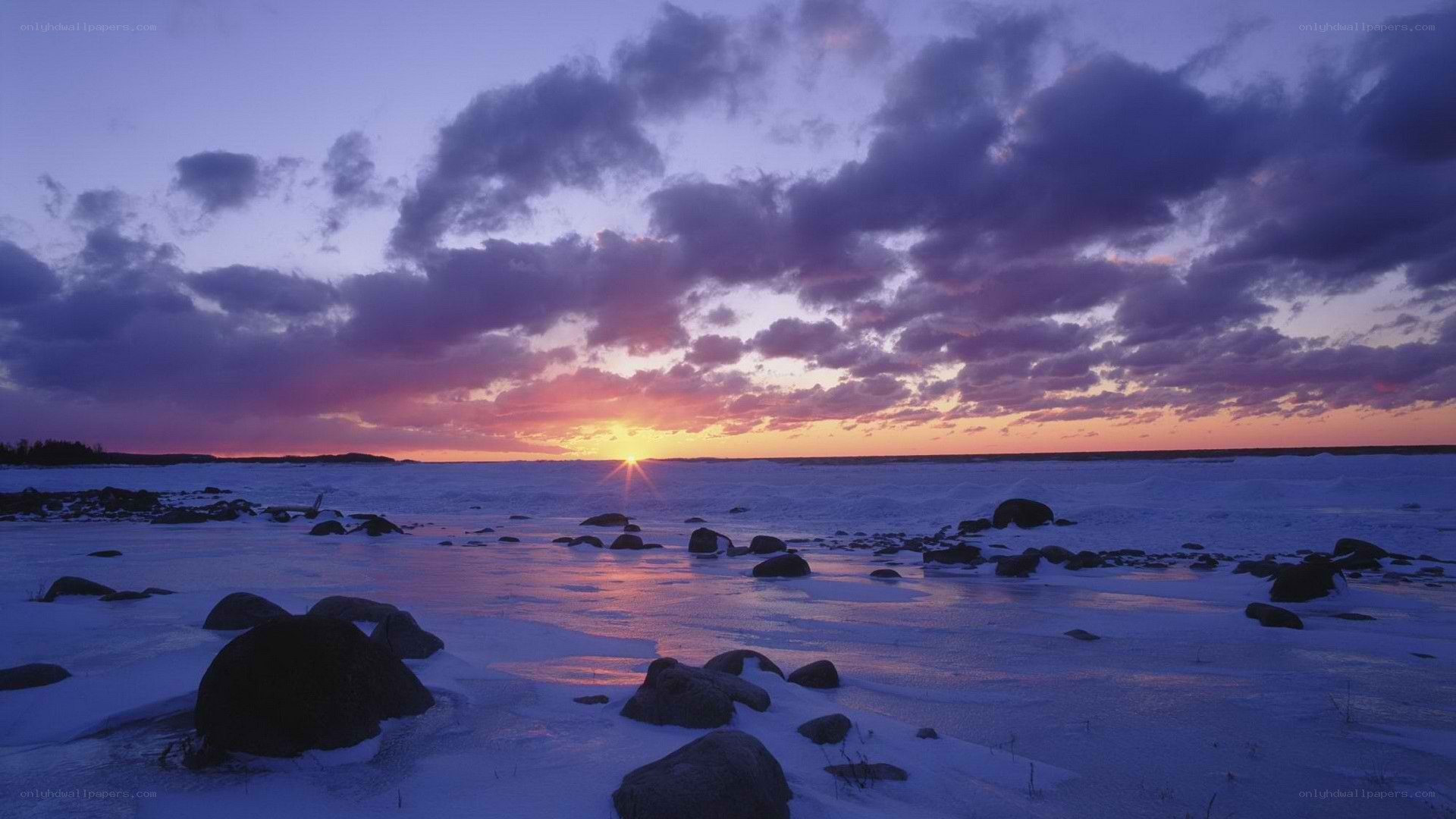 Sunset over frozen coastline