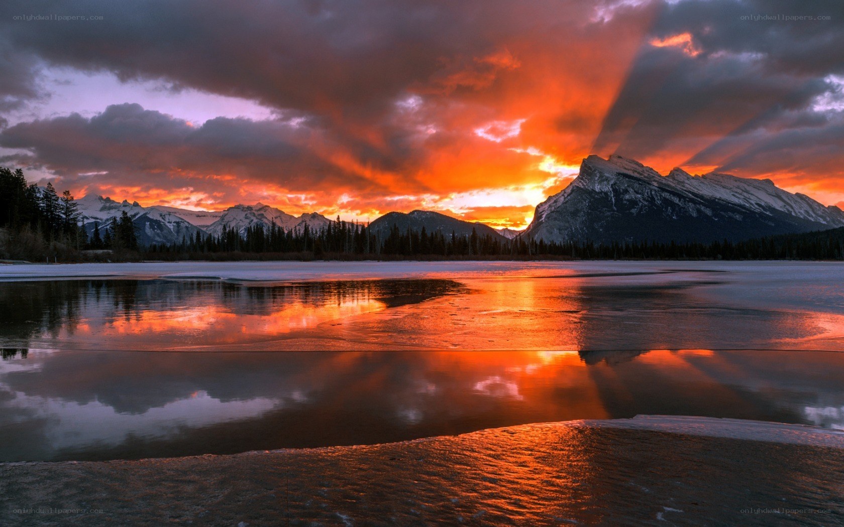 Sunset over frozen lake