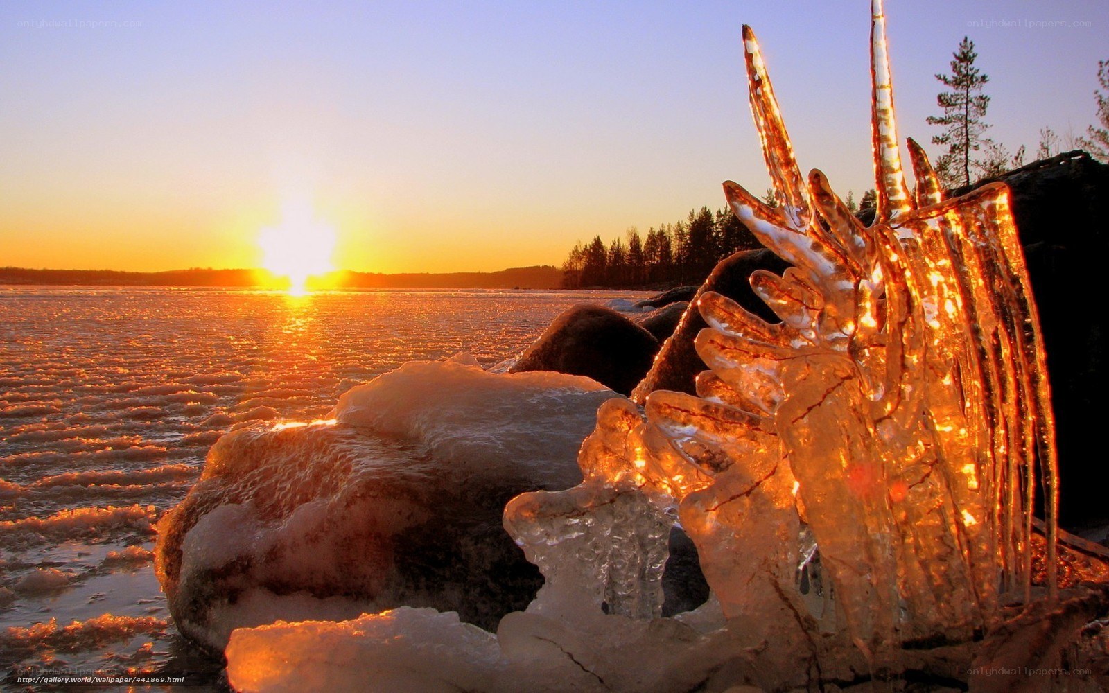 Sunset over frozen lake