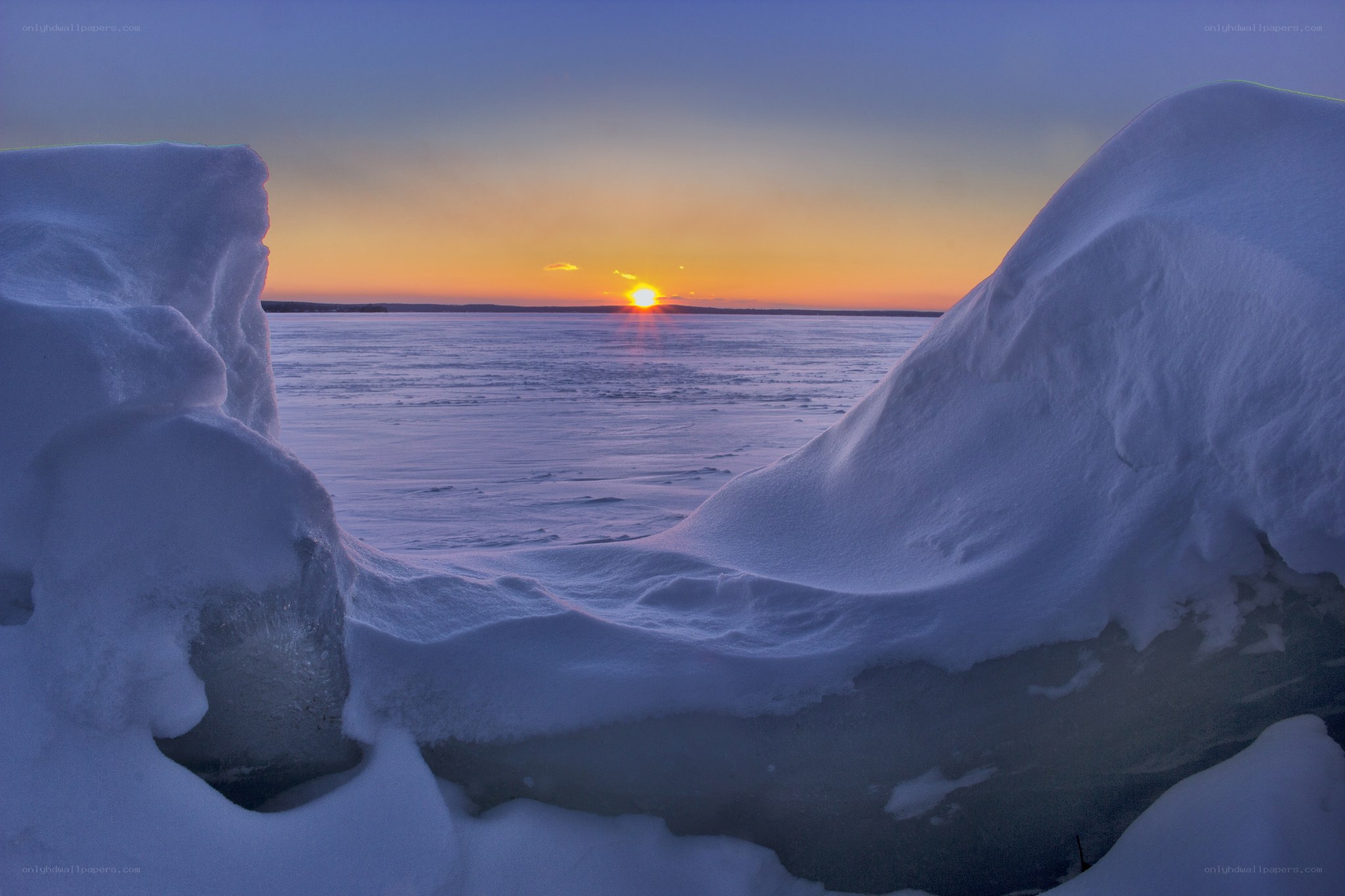 Sunset over frozen lake