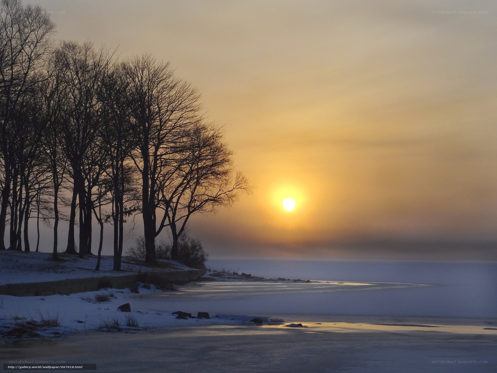 Sunset over frozen lake