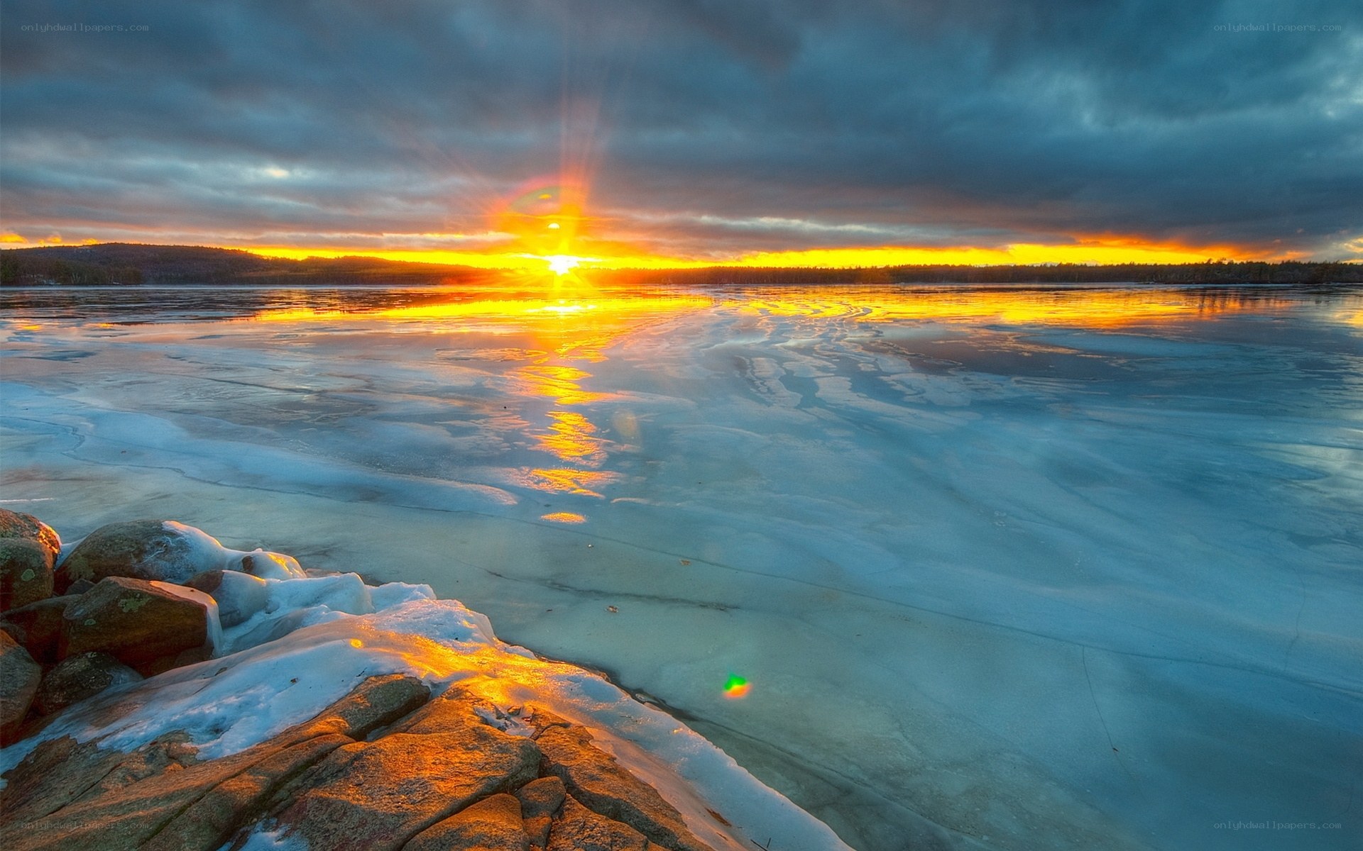 Sunset over frozen lake