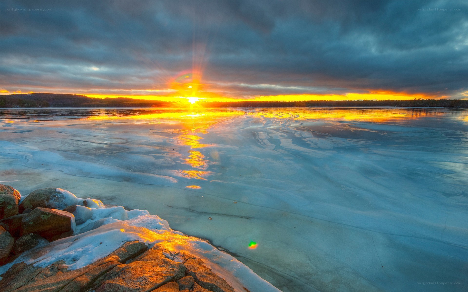 Sunset over frozen lake