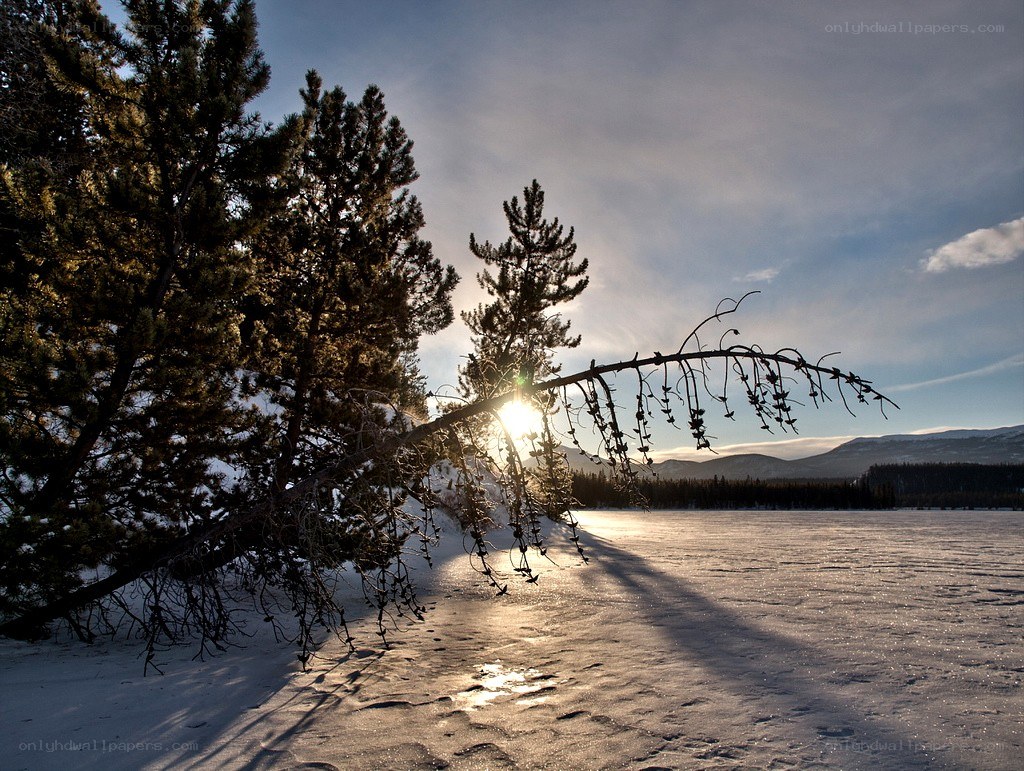 Sunset over frozen lake