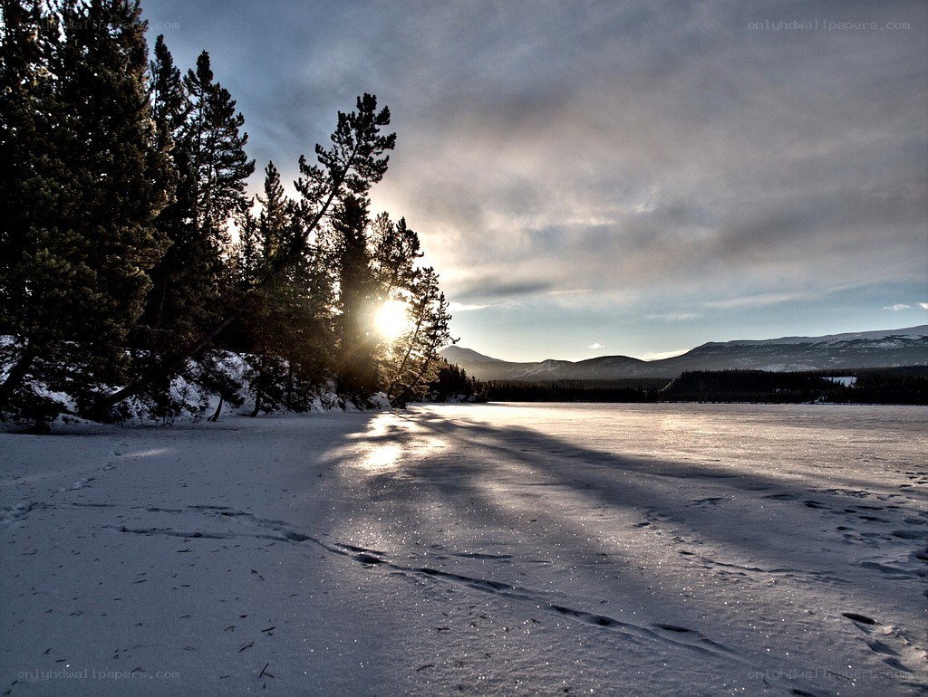 Sunset over frozen lake