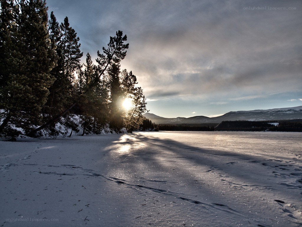 Sunset over frozen lake