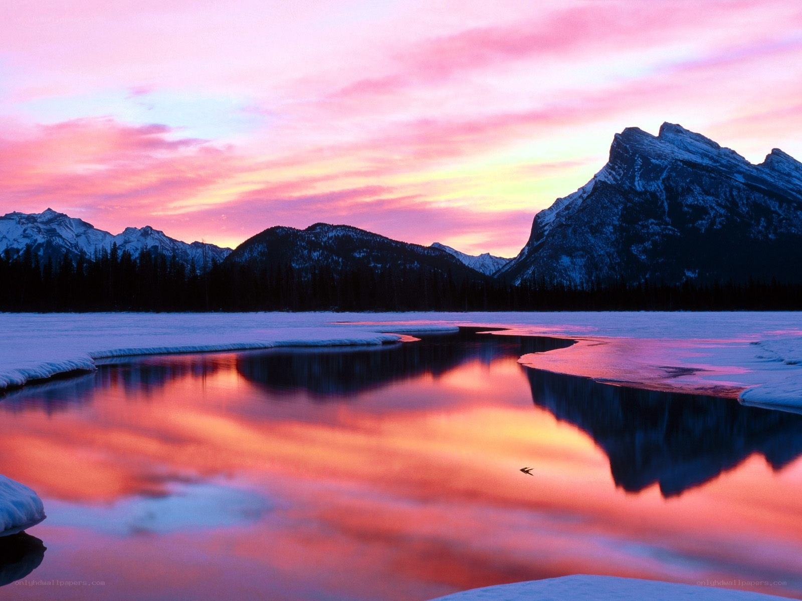 Sunset over frozen lake