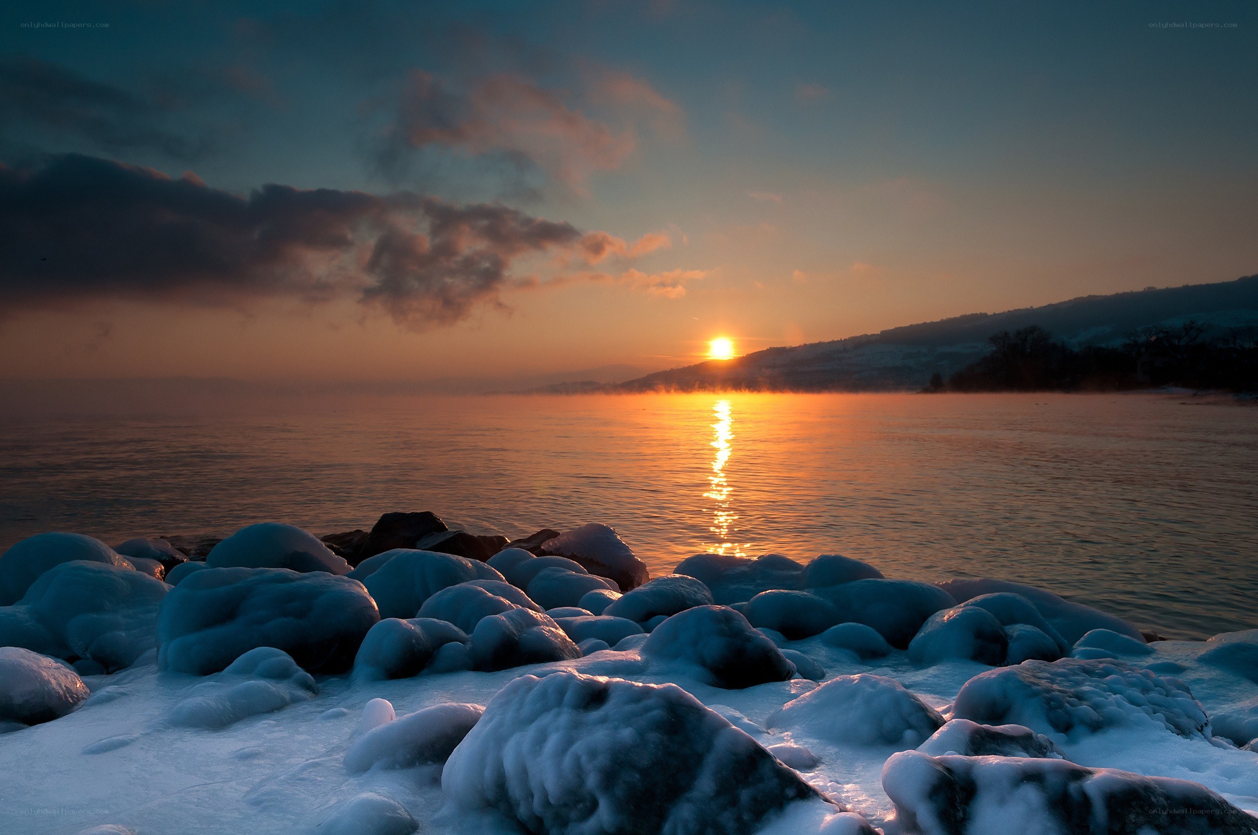 Sunset over frozen lake