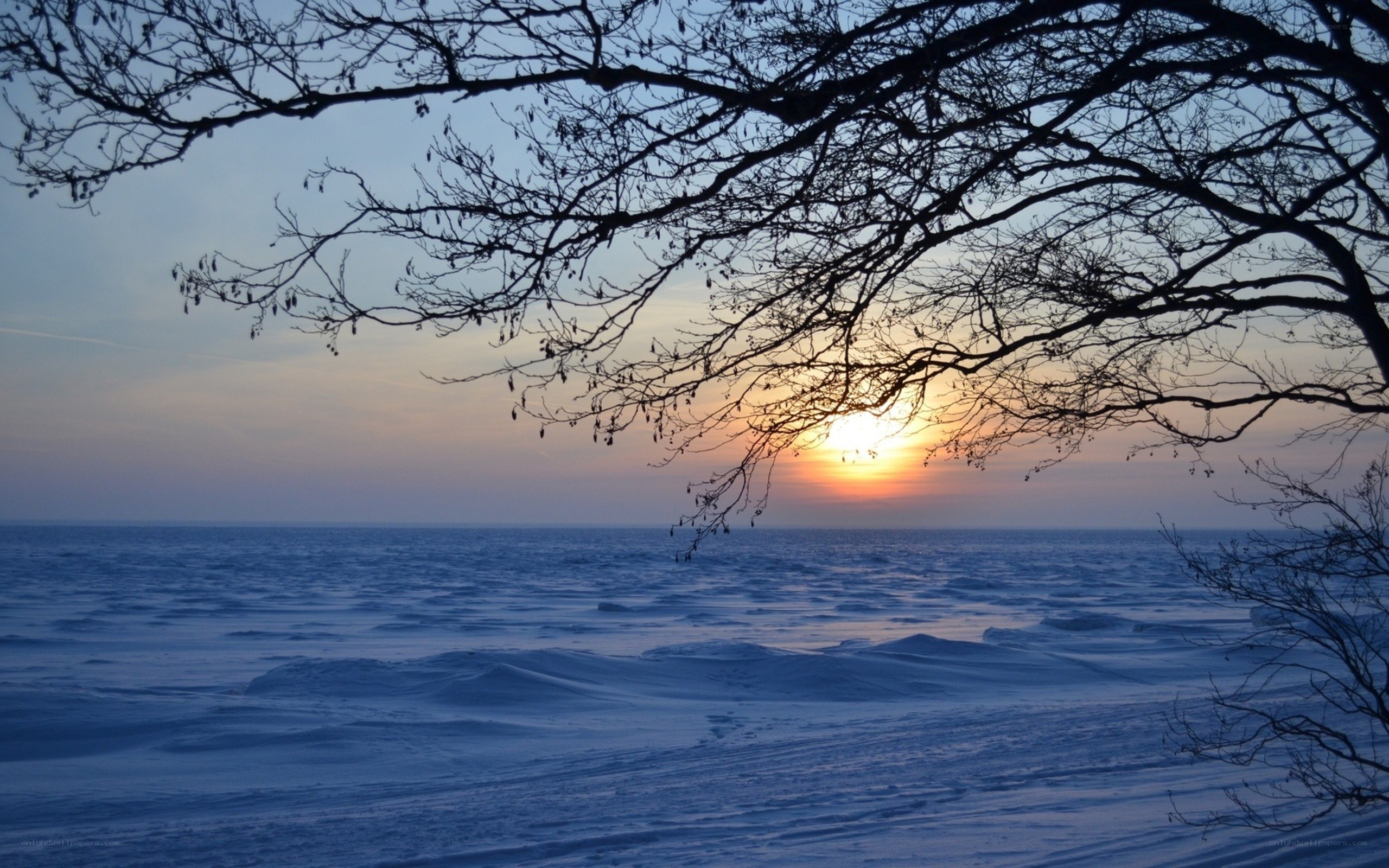 Sunset over frozen lake