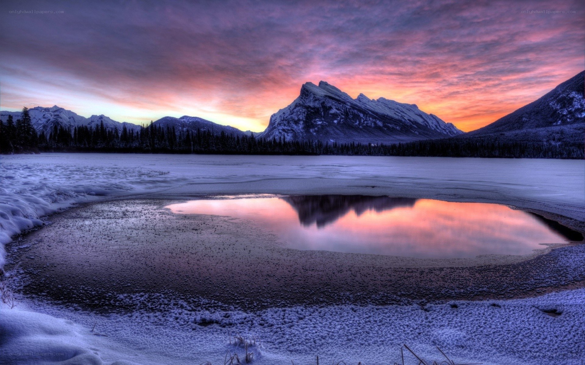 Sunset over frozen lake