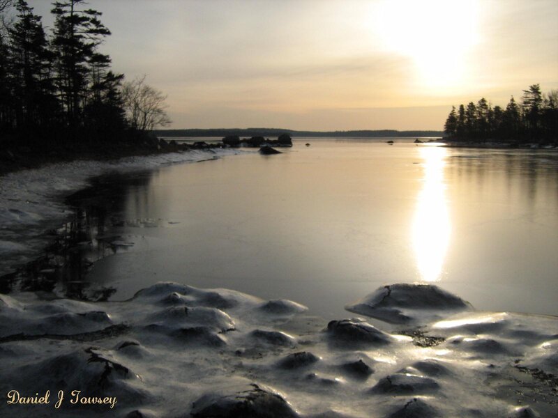 Sunset over frozen lake