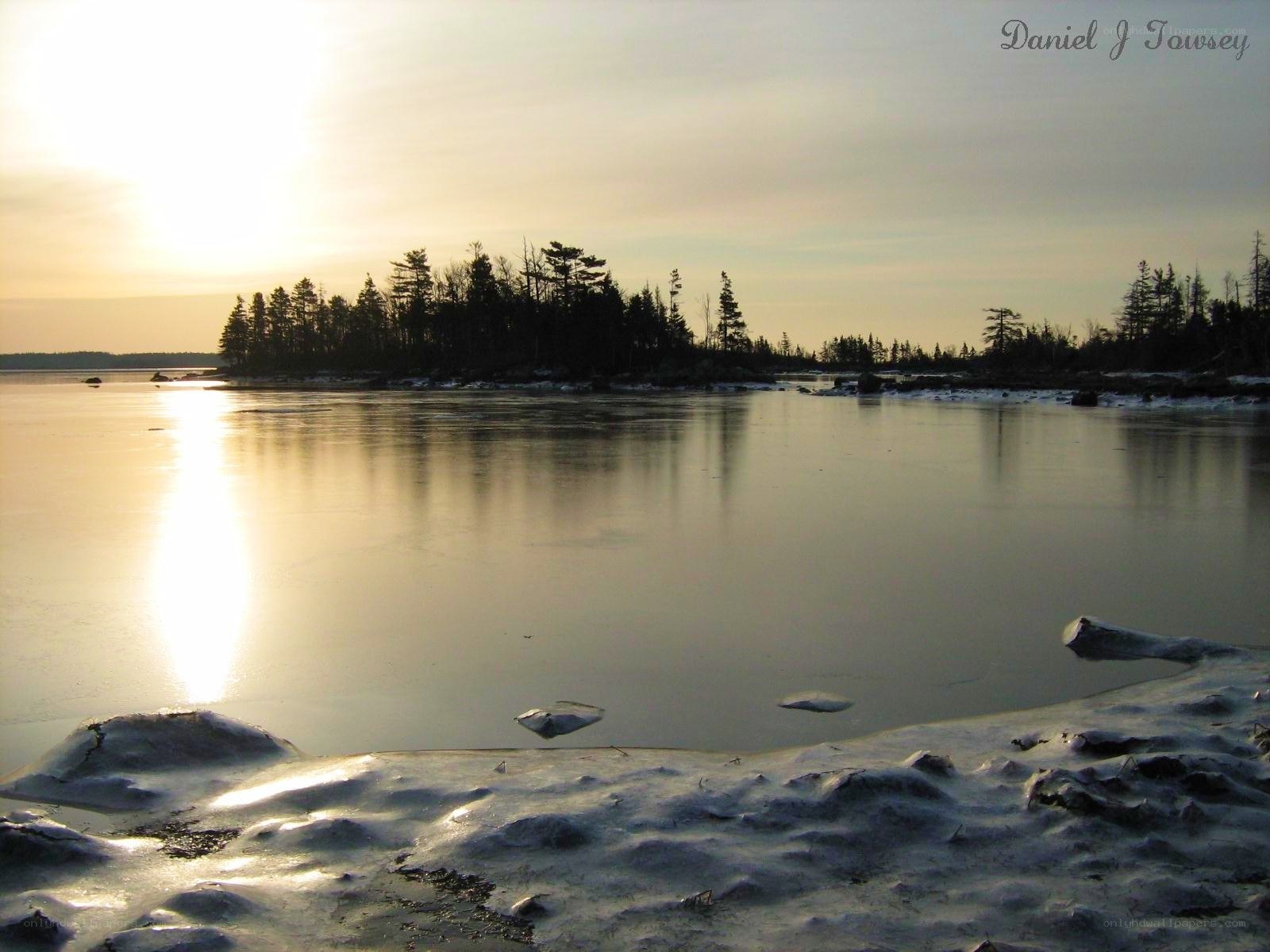 Sunset over frozen lake