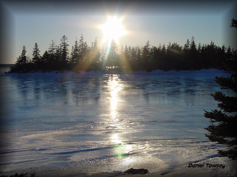 Sunset over frozen lake