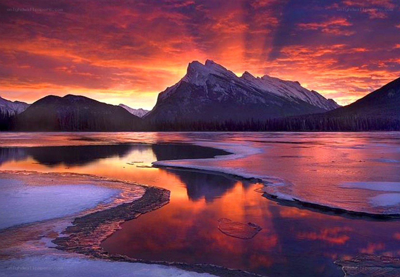 Sunset over frozen lake