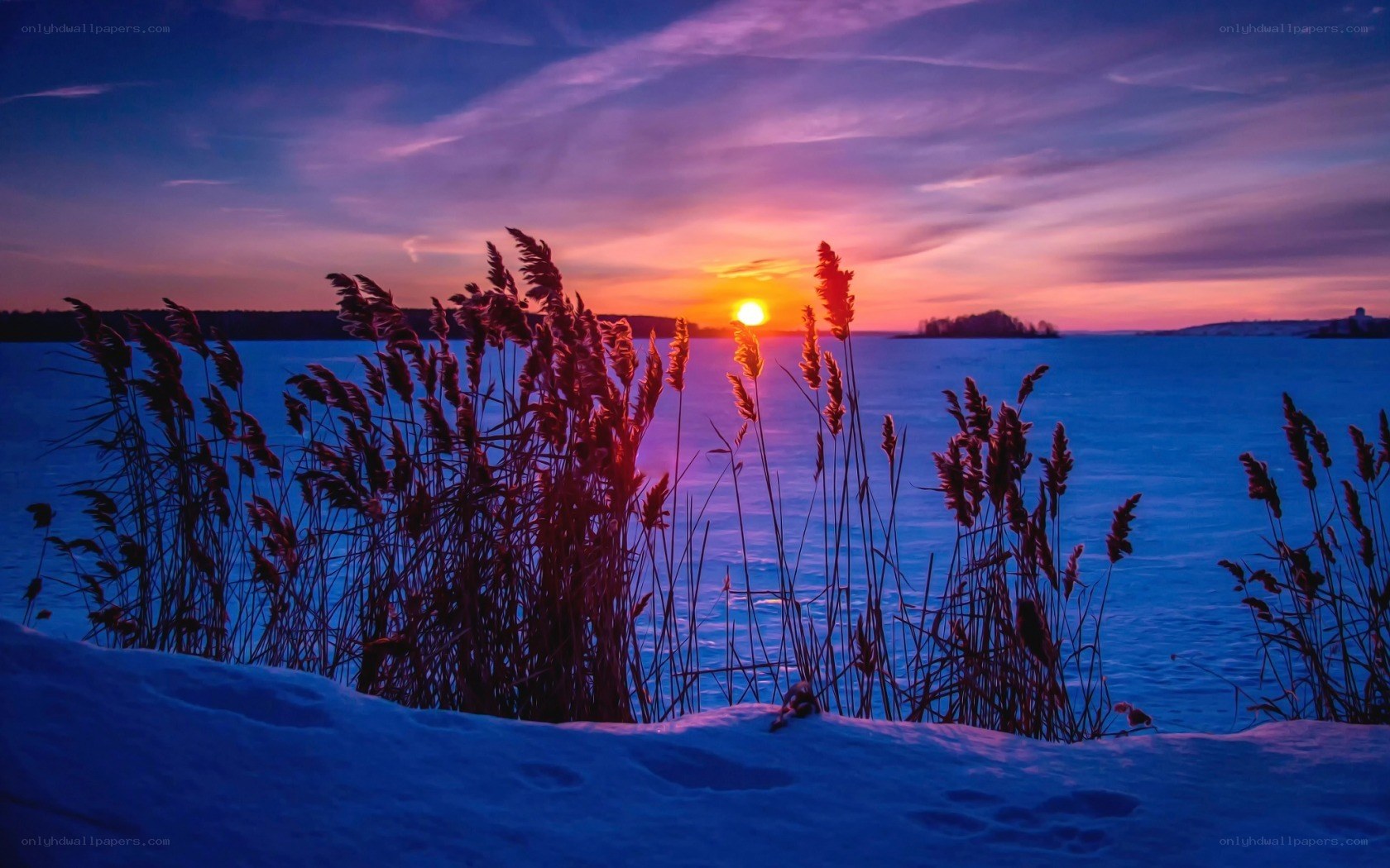 Sunset over frozen lake