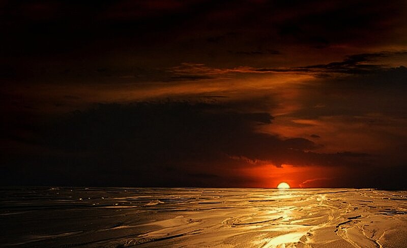 Sunset over Frozen Lake — Orange, Dramatic, Photograph