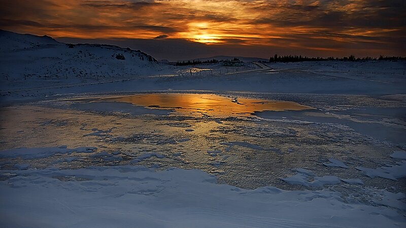 Sunset over frozen landscape