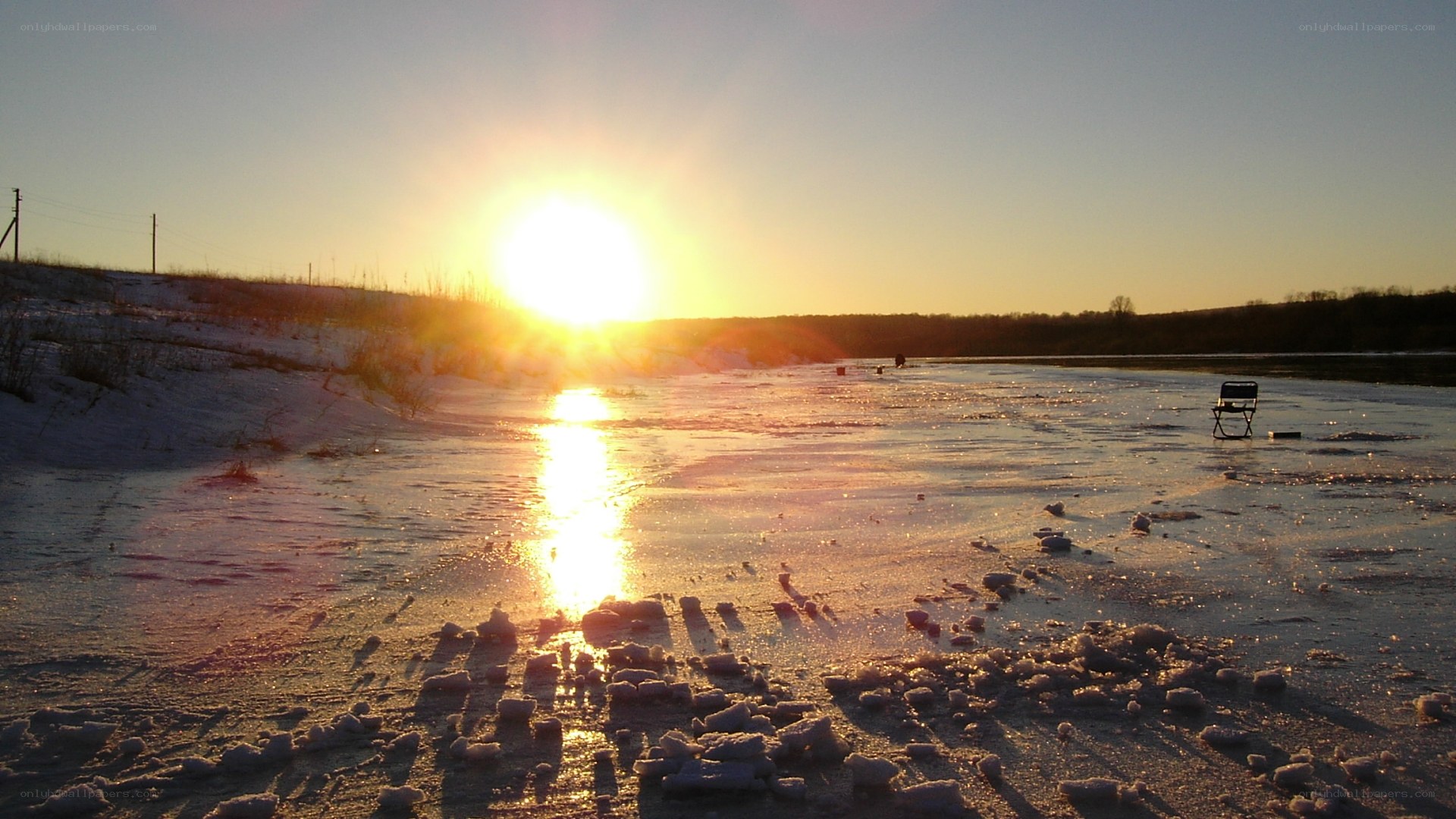 Sunset over frozen river