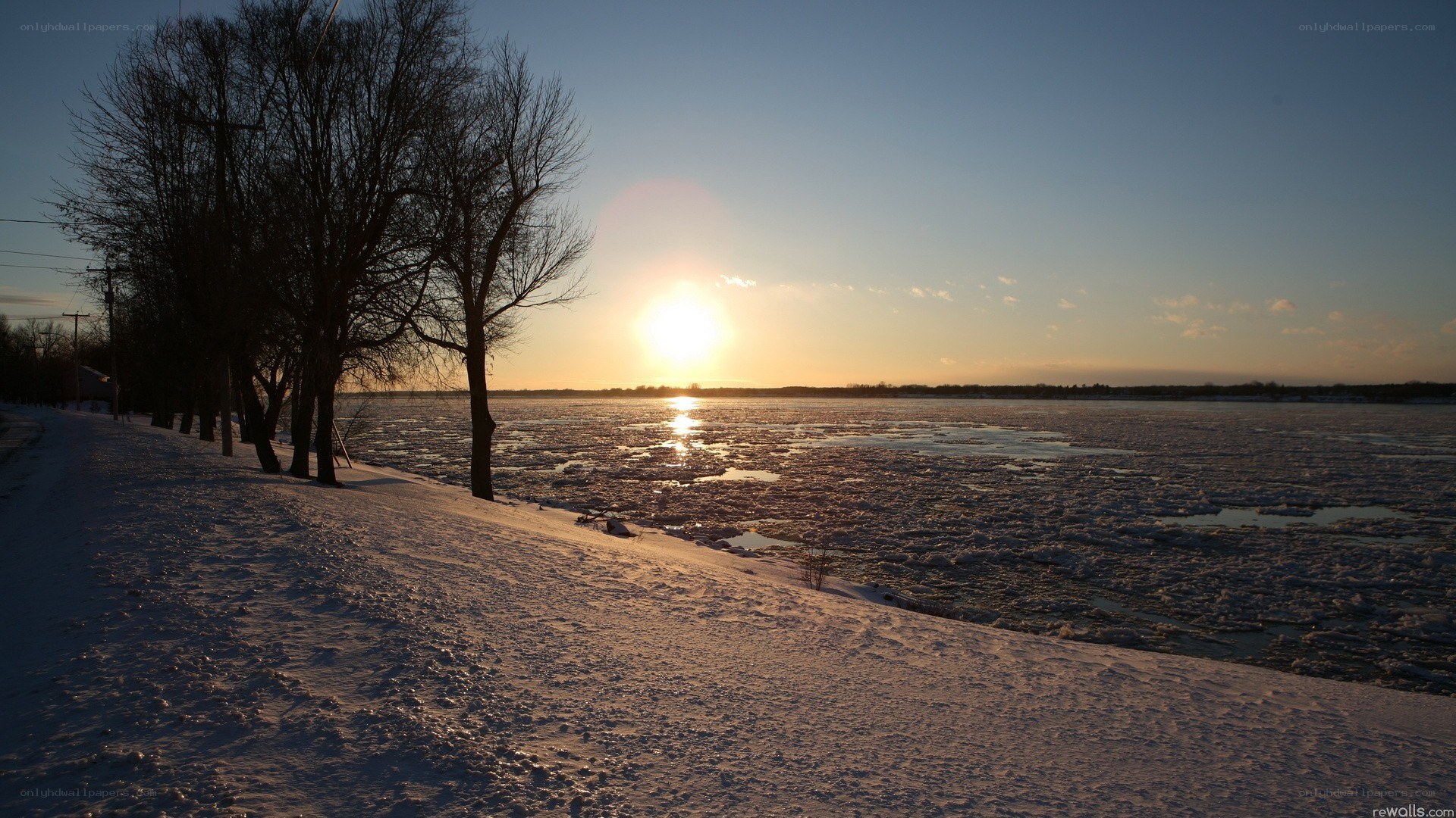 Sunset over frozen river