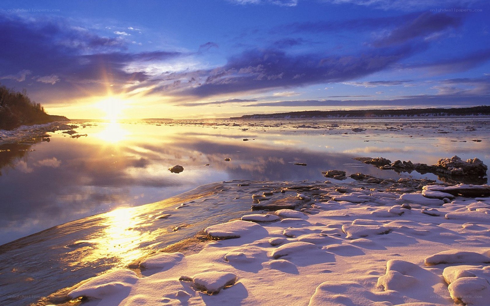 Sunset over frozen river