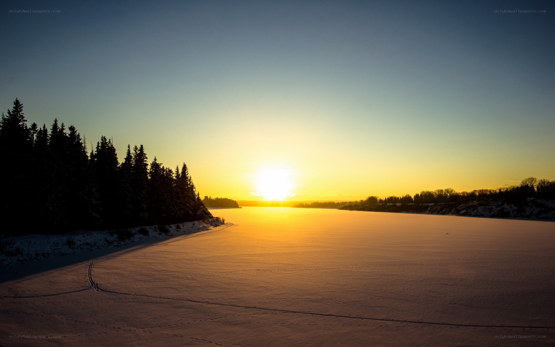 Sunset over frozen river