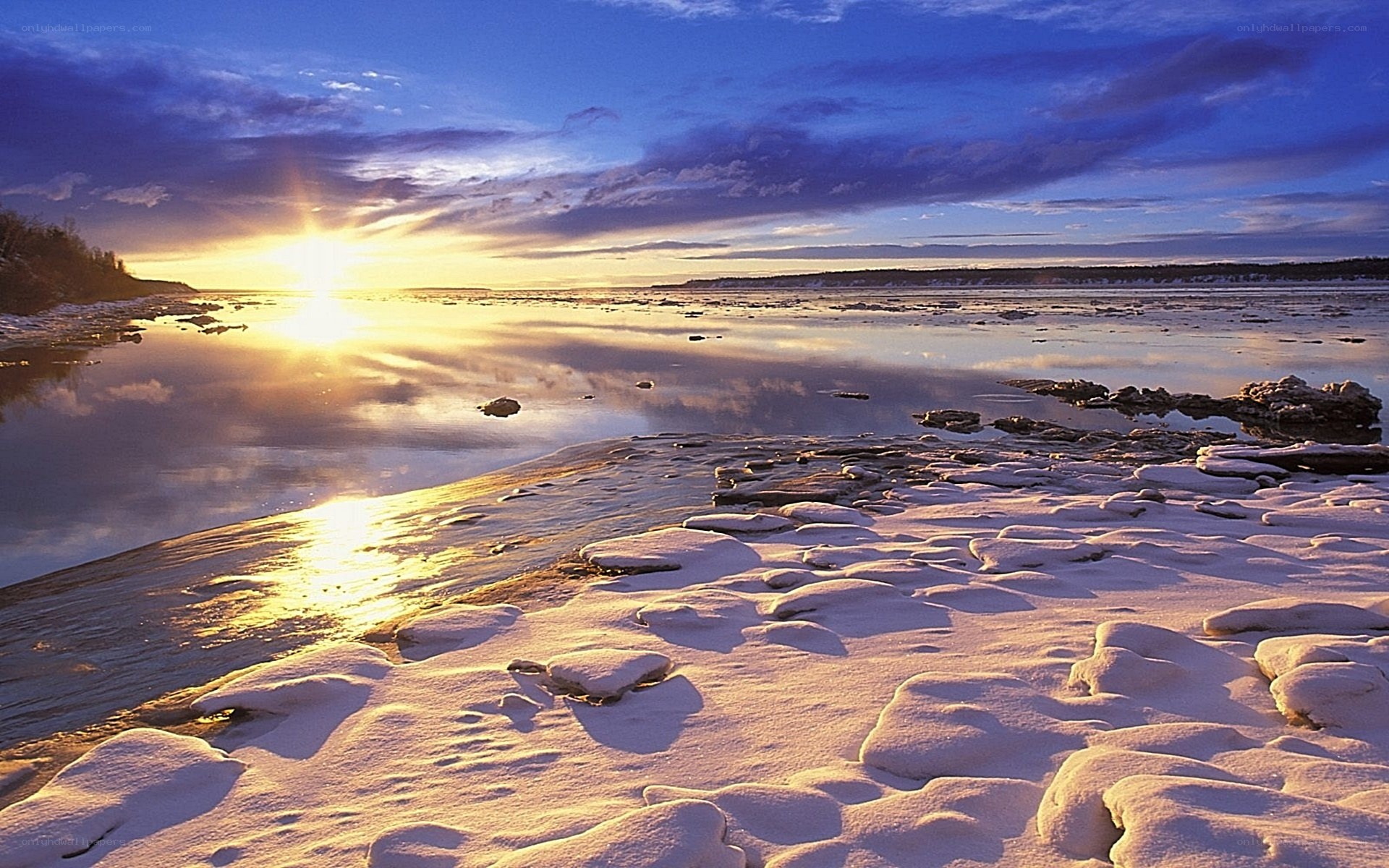 Sunset over frozen river