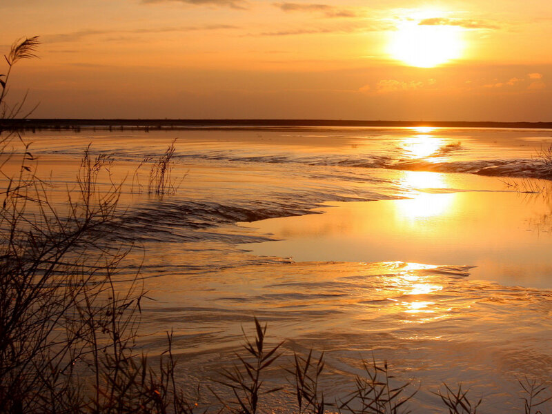 Sunset over Frozen River — Orange, Serene