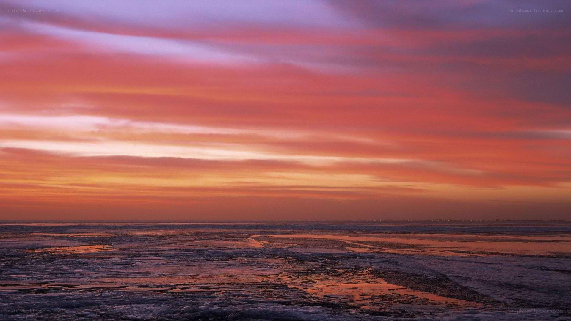 sunset over frozen sea