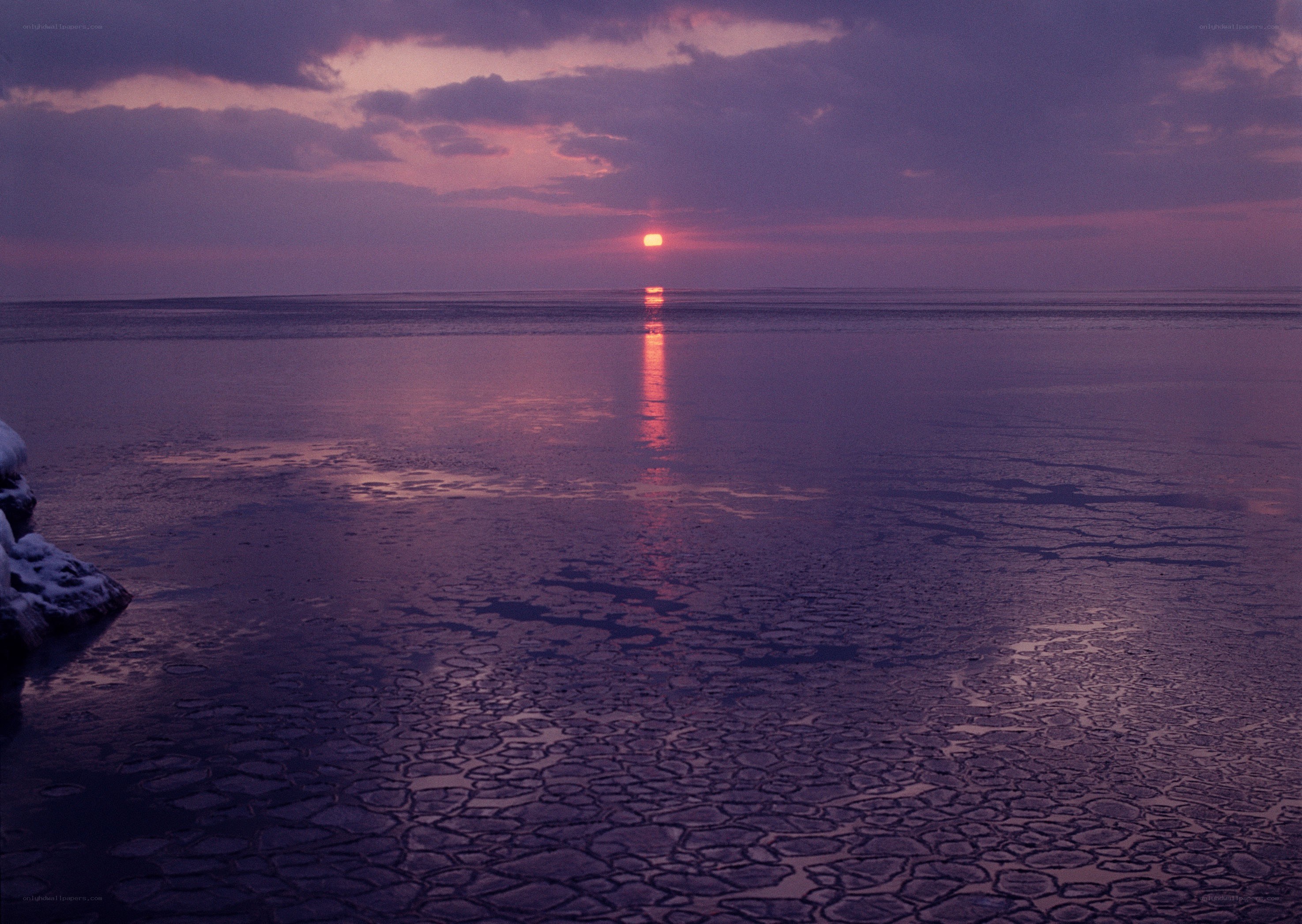 Sunset over frozen sea