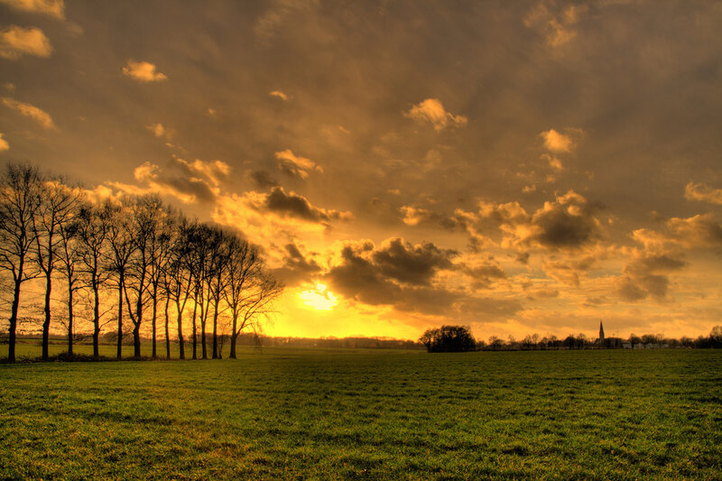 Sunset over Green Field — Dramatic