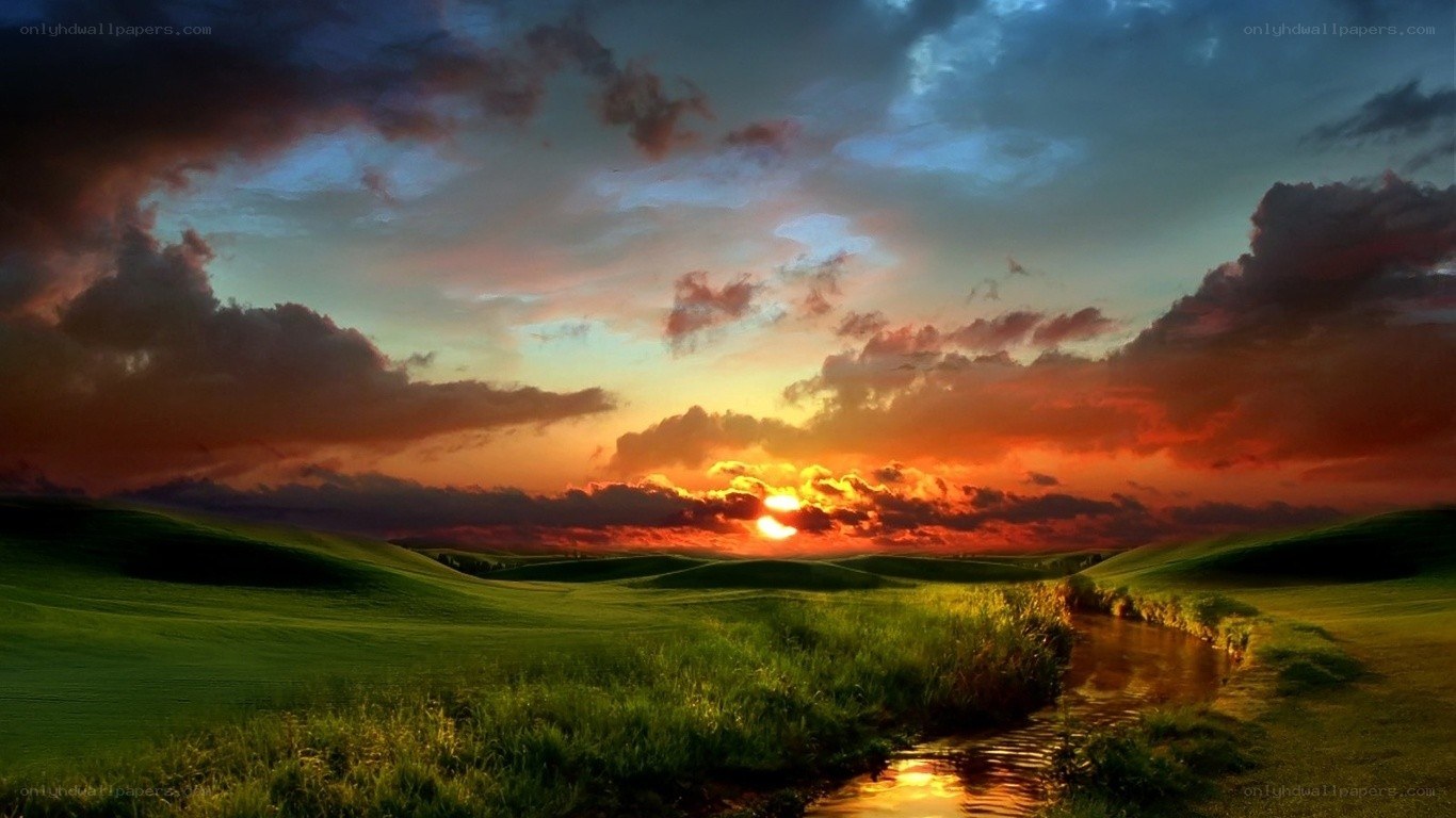 Sunset over green hills