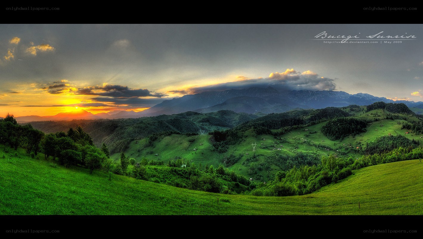 Sunset over green hills