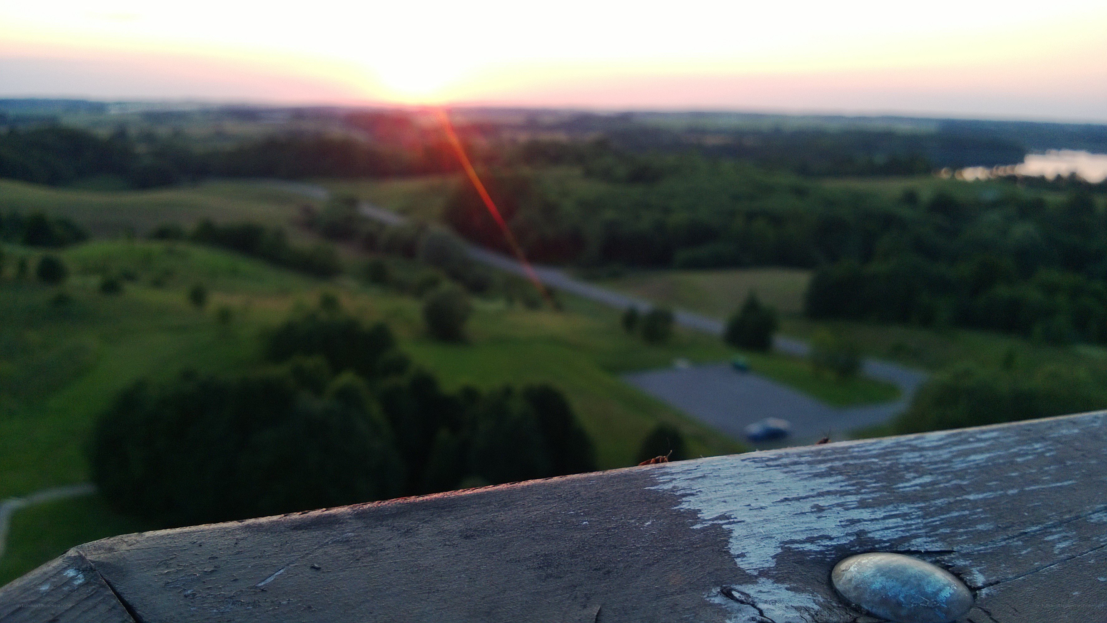 sunset over green hills