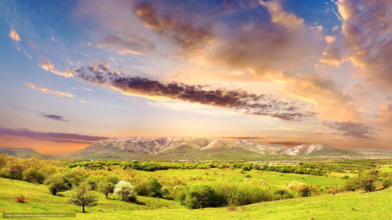 Sunset over green valley