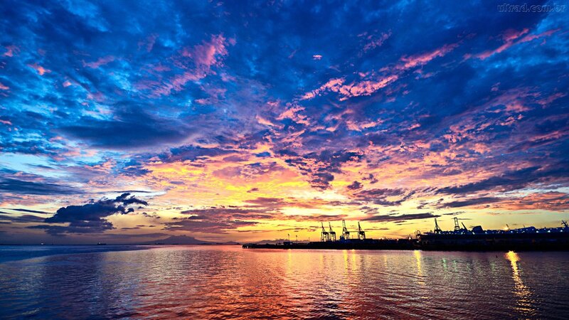 Sunset over Harbor — Blue, Dramatic, Photograph, Cranes